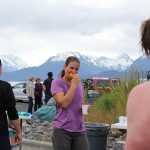 Ashley Van Hemert bites into an orange slice after completing the Spit Run on June 25. Hemert came in 33rd place in the runner's division with a time of 0:46:46.45