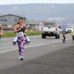 (left to right) Joan Ryan of Anchorage and Fabiola Urbina of Chile run down the Spit as they strive to reach the finish line of the June 25 Spit Run. The two women finished in 205th and 206th place.