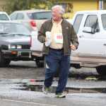 Robert Letson, 68, of Anchor Point laughs as acquintances cheer him on from across the street on the Spit. Letson finished 45th out of 49 in the walkers division of the Saturday, June 25 Spit Run with a time of 1:55:09.64.