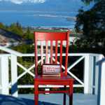 The Red Chair sits on the deck at Halcyon Heights Bed and Breakfast.
