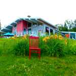 The Red Chair sits on the lawn near the Halcyon Heights Bed and Breakfast.