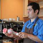 Carmen Ricciardi scoops raspberry sorbetto over Tahitian vanilla gelato. Ricciardi's new gelato shop, Carmen's Gelato, opened on the Spit on June 11 and will stay open through Labor Day.-Photos by Anna Frost, Homer News