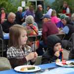 Reagan Steen, 5, and her brother Brennan, 7, enjoy popscicles after their barbecue lunch at the South Peninsula Hospital 60th Anniversary Party on Saturday, July 9.