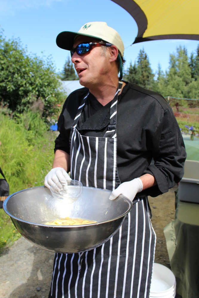 Chef Richard Nell of The Homestead Restaurant gives a demonstration on pickling ginger using a simple brine. Nell started off the Synergy Gardens' First Annual Great Garlic Scape Festival.