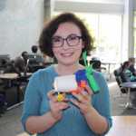 Homer High School senior Eryn Gillam shows off a motorcar created by her and her teammates during an engineering lab activity at the ANSEP Accerlation Academy at University of Alaska Anchorage.