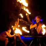 Quixotic performers play with fire on stage. The group's Salmonfest music festival performance on Saturday, August 6 will involved fire, said Quixotic executive producer Mica Thomas.