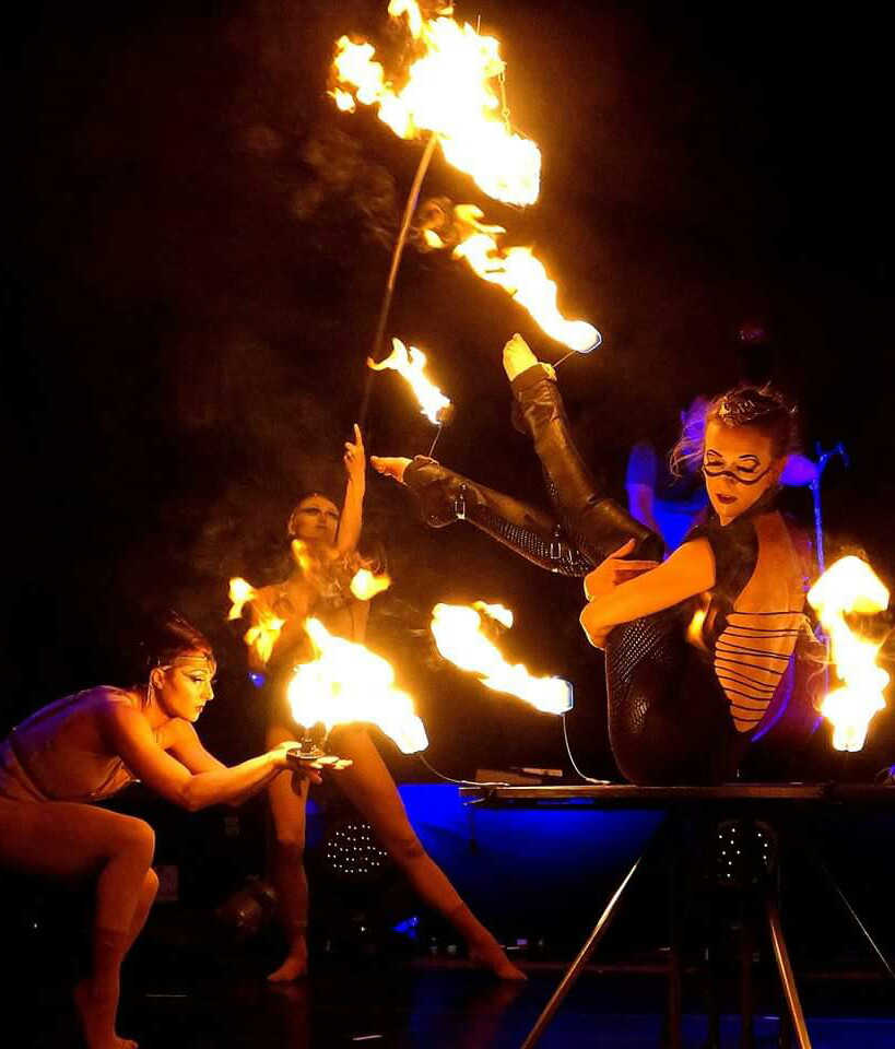 Quixotic performers play with fire on stage. The group's Salmonfest music festival performance on Saturday, August 6 will involved fire, said Quixotic executive producer Mica Thomas.