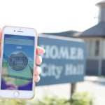 The Pokestop at Homer City Hall is located at the sign in front of the building.