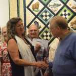 Jack Regan, president of Patrons of the Pratt, or POPS, on Tuesday night presents Pratt Museum Board President Sara Jackinsky with two checks totalling $425,000 - the balance of a pledge POPS made in 2011 to raise $500,000 for the museum's capital construction fund. POPS had earlier donated $75,000 to help with design of the museum's proposed new building. Members of POPS, including past board presidents, attended the ceremony. Regan presented the checks in front of this year's quilt to be raffled, one of the ways POPS raises funds. In the back are, from left to right, Lucy Cutting, Nancy York, Bob Neubauer, Nancy Livingston (behind Regan) and Jackie Dentz.