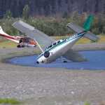 A K-Bay Air plane, left, and a Cook Inlet Aviation plane, right, are bothe nose down on the beach in Chinitina Bay on the west side of Cook Inlet. Both planes hit soft sand while taxiing.