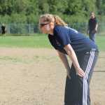 Casey Moss of Beluga Lake Lodge team waits on first for her teammate to hit the ball so she can advance to second during the first championship game of the Homer city league tournament on Sunday, July 31 at Jack Gist Park.