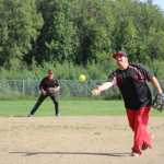 Mean Machine team coach and pitcher Robert Toner lets go off a pitch during the first game against Beluga Lake Lodge in the Homer city league championships.