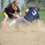 Mean Machine player Hannah Gordon tags out Joel Pietsch during the first championship game of the Homer city league tournament on Sunday, July 31.