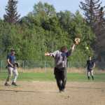 Beluga Lake Lodge pitcher Paul Gavenus misses an infield fly during BLL's second game against Mean Machine for the city tournament championship title on Sunday, July 31.