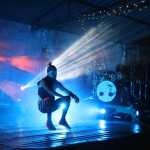 Quixotic dancer Mikey Bravo performs a series of acrobatic dance moves at Salmonfest in the early hours of Sunday, August 7. Quixotic incorporates different styles of dance as part of their unique performance style.