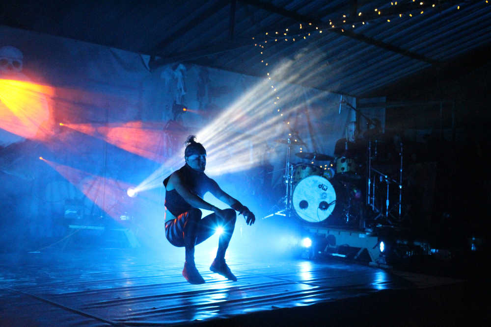 Quixotic dancer Mikey Bravo performs a series of acrobatic dance moves at Salmonfest in the early hours of Sunday, August 7. Quixotic incorporates different styles of dance as part of their unique performance style.