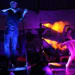 A Quixotic ballet dancer twists her body to the violin music played during the group's performance at Salmonfest in the early hours of Sunday, August 7. Quixotic incorporates different styles of dance and music as part of their unique performance style.