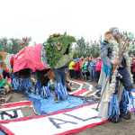 The King Sam parade kicked off at the site of the human mosaic in the rodeo arena where a King Triton and salmon puppet Queen Marine led the procession as a speaker talked about the importance of clean Alaskan waters.