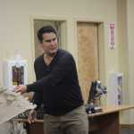 Hemp advocate Jack Bennett passes around a BMW automobile part made from a hemp-plastic composite at the Homer City Council meeting on Monday. Bennett did a presentation on industrial hemp before the council.