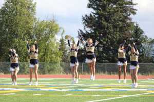 The Mariner football cheer team performs a dance at half-time of the Homer versus Barrow game.