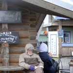 Bob Tayne of Tyler, Texas, reads outside Coal Town Coffee Tuesday on the Homer Spit. Tayne visited Homer on the M/V Maasdam. Coal Town was one of many Spit businesses that closed on Monday, Labor Day.