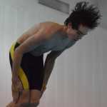 Spencer Warren of Homer eyes the water as he performs a dive Friday at the Kenai Invite at Kenai Central High School.