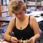 Cassidy Wylde uses bone to create a holder for a stone she values during the Sept. 9 Objects of Importance workshop at Homer Flex.