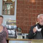 Homer Chamber of Commerce President Tom Stroozas calls $1,000 catch-and-release drawing winner Michael Brooks of Tipton, Mich., and leaves a message as Derby Coordinator Kim Royce looks on at the Homer Jackpot Halibut Derby awards event on Wednesday, Sept. 21.
