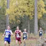Photo by Jeff Helminiak/Peninsula Clarion Cordova's Zach Hamberger and Grace Christian's Trent Fritzel lead Homer's Jacob Davis and Jordan Beachy down a hill midway through the Class 1-2-3A race at the Region III meet at Tsalteshi Trails on Saturday. Beachy and Davis led Homer to the boys team crown.