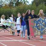 Homer High's freshman class carries their float during the Ancient Greece-themed Parade of Classes at halftime at the Saturday, Sept. 24 homecoming game.