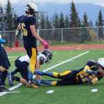 Mariner Noah Fisk makes a first down a few yards from the end zone after being tackled by a Redington player at the Homer High School homecoming football game on Saturday, Sept. 24.