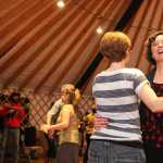 Jenifer Dickson dances with a partner during the Homer Folk School grand opening event on Saturday, Oct. 8.