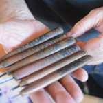 Claudio Orso-Giacone holds his wood-block print carving tools. Orso-Giacone names each tool to make it easier for him to find.