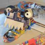 Some of the recycled box masks made by Claudio Orso-Giacone in a workshop at Bunnell Street Arts Center last month.