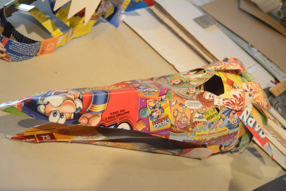 Some of the recycled box masks made by Claudio Orso-Giacone in a workshop at Bunnell Street Arts Center last month.