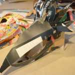 Some of the recycled box masks made by Claudio Orso-Giacone in a workshop at Bunnell Street Arts Center last month.