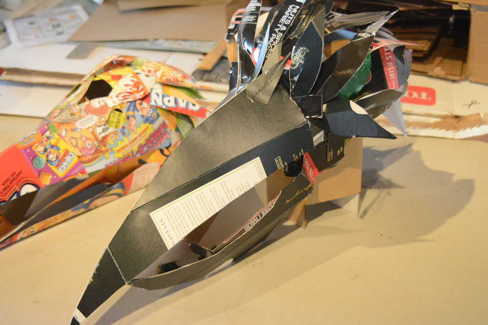 Some of the recycled box masks made by Claudio Orso-Giacone in a workshop at Bunnell Street Arts Center last month.