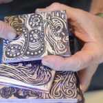 Claudio Orso-Giacone holds some of his wood-blocks for making prints at Bunnell Street Arts Center.