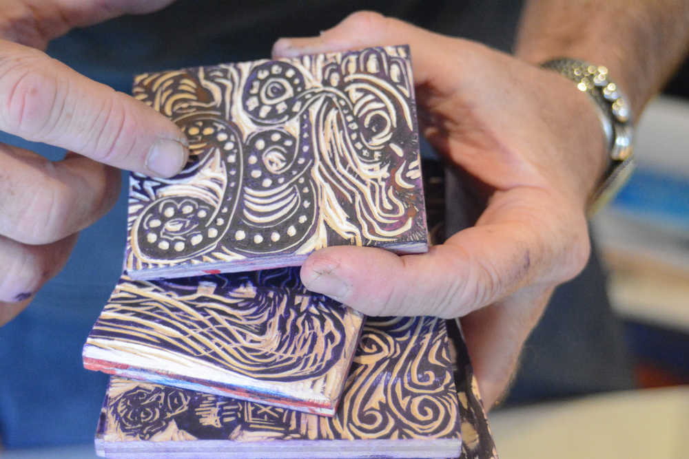 Claudio Orso-Giacone holds some of his wood-blocks for making prints at Bunnell Street Arts Center.