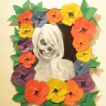 Law School Actually Killed Me origami and photography piece is by Carol Comfort, Devry Garity and Kelsey Waldorf, with Waldorf as the model in the photo.