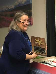 South Peninsula Hospital nurse Rebecca Lundquist displays the Melissa Ann Peters Memorial Award she was recently given in recognition of her lifelong commitment to the nursing profession, for championing trauma care, and for her service across Alaska as a flight nurse, dynamic educator and humanitarian. The award was given by the Governor's Alaska council on Emergency Medical Services, or ACEMS.