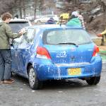 Defying breakup Seth Adkins washes the car of a Homer High School Mariners baseball team supporter at a fundraiser on Saturday at Wells Fargo. Baseball team members and supporters washed away a winter&rsquo;s worth of grime. &ldquo;For me this makes it like spring is coming,&rdquo; said Lotus Condon, the mother of baseball player Zach Condon. &ldquo;Baseball. Car washes.&rdquo;