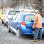 Defying breakup Zach Condon, left, washes the car of a Homer High School Mariners baseball team supporter at a fundraiser on Saturday at Wells Fargo. Baseball team members and supporters washed away a winter&rsquo;s worth of grime. Helping him are, middle, Austin Dash, and right, Seth Adkins. &ldquo;For me this makes it like spring is coming,&rdquo; said Lotus Condon, the mother of baseball player Zach Condon. &ldquo;Baseball. Car washes.&rdquo;