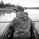 Kim McNett, the featured artist for this year’s Kachemak Bay Shorebird Festival, canoes an Alaska lake.-Photo by Bjorn Olson