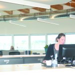 Sarah Jones works at the front counter at the new Harbor Office.-Photo by Michaael Armstrong, Homer News