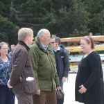 King Harald V, center, and  the Norwegian Ambassador to the United States, Kåre Aas, left, visit with Tutka Bay lodge owner Kirsten Dixon,  right, as Homer Mayor Beth Wythe, far left, watches.-Photo by Michael Armstrong; Homer News