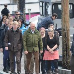 King Harald V, center, arrives at Tutka Bay Lodge with the Norwegian Ambassador to the United States, Kåre Aas, left, as lodge owner Kirsten Dixon, to his right, and Mandy Dixon escort him.-Photo by Michael Armstrong; Homer News