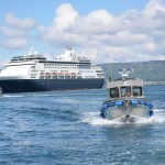 The P/V Augustine passes by the M/V Statendam as the Alaska Public Safety boat leaves the Homer Harbor on Tuesday. Troopers provided security for King Harald V on his visit to Homer.-Photo by Michael Armstrong; Homer News