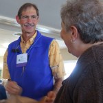 Frank Soos chats with a conference goer.