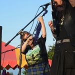 Kathy Buys, left, on fiddle, and Lief Sorbye, right, on mandolin, perform with Tempest last Friday at Karen Hornaday Park for the opening of CeltFest and the Highland Games. They played several songs based on Robert Burns poems. For photos and results of the games, see page 12.-Photo by Michael Armstrong, Homer News